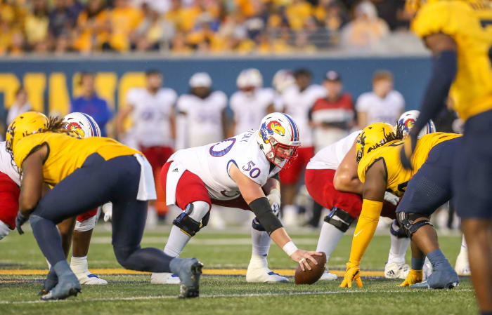 Sep 10, 2022; Morgantown, West Virginia, USA; Kansas Jayhawks offensive lineman Mike Novitsky (50) over center during the second quarter against the West Virginia Mountaineers at Mountaineer Field at Milan Puskar Stadium. Mandatory Credit: Ben Queen-USA TODAY Sports